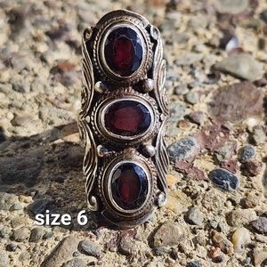 Sterling silver long ring with red garnets stones size 6 very ornate